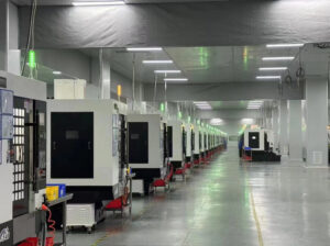 Home High-precision CNC machining center in operation, producing complex metal components.