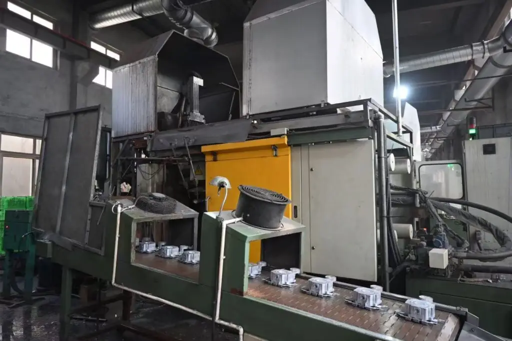 High-pressure die casting machine in operation for precision metal parts manufacturing.