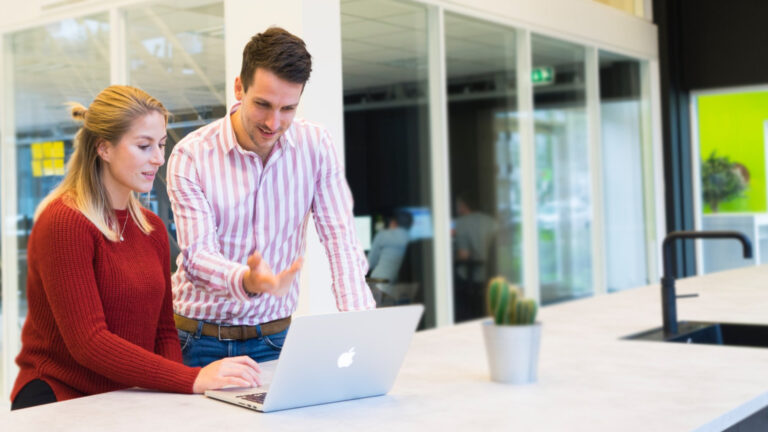 Professional discussing manufacturing project details and pricing options with a client.