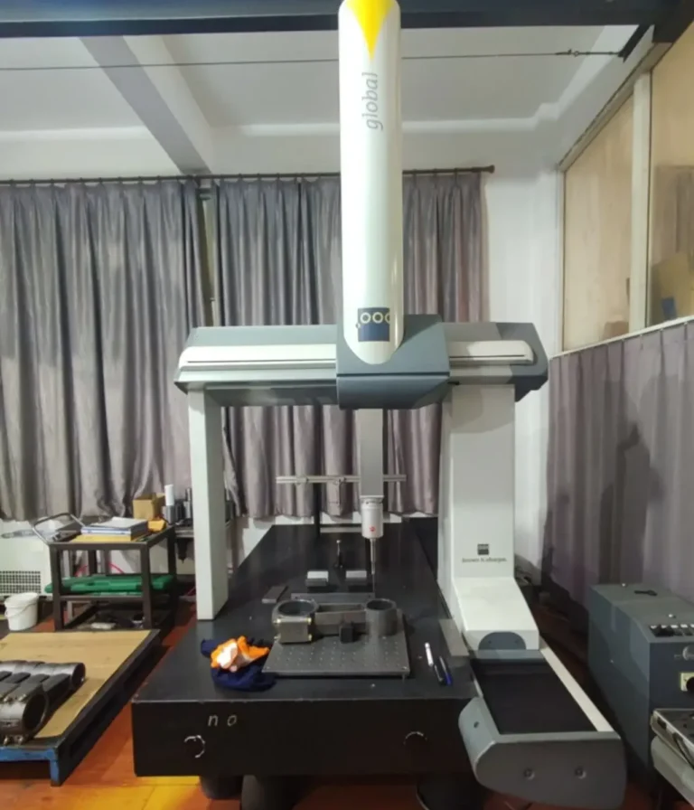 Quality control technician performing precision dimensional inspection on a die-cast metal component.