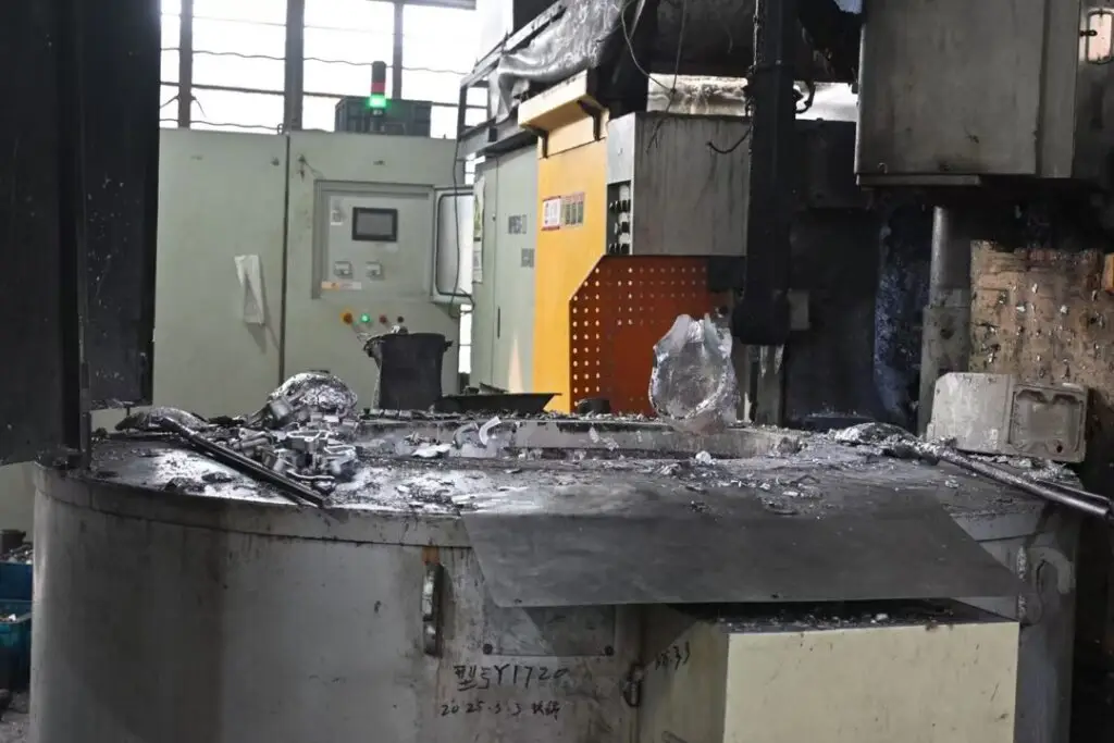 High-pressure die casting process with molten metal being injected into a precision mold.