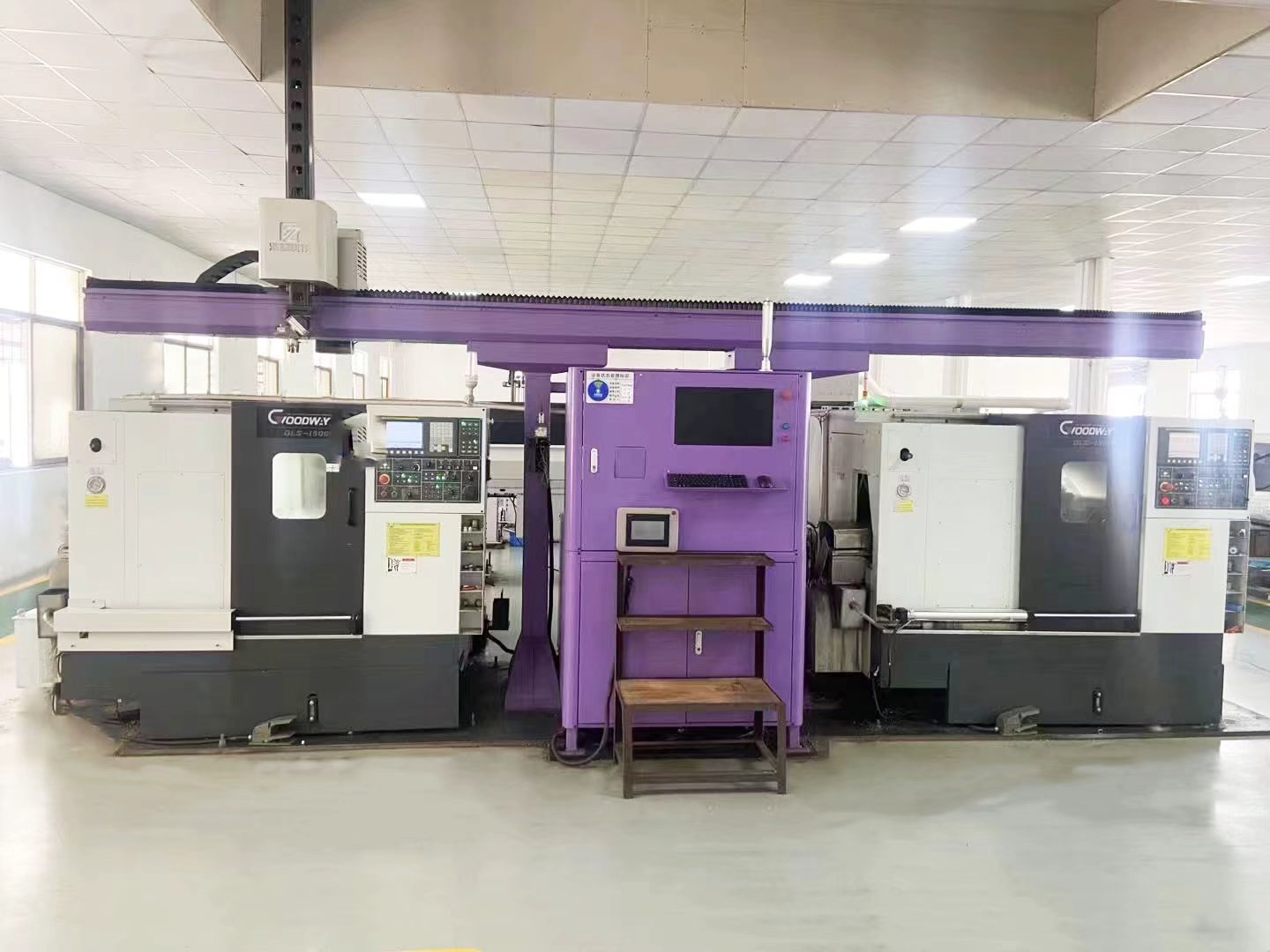 CNC Machining Automated CNC turning centers with overhead gantry loader system for high-volume production at Sureton factory.