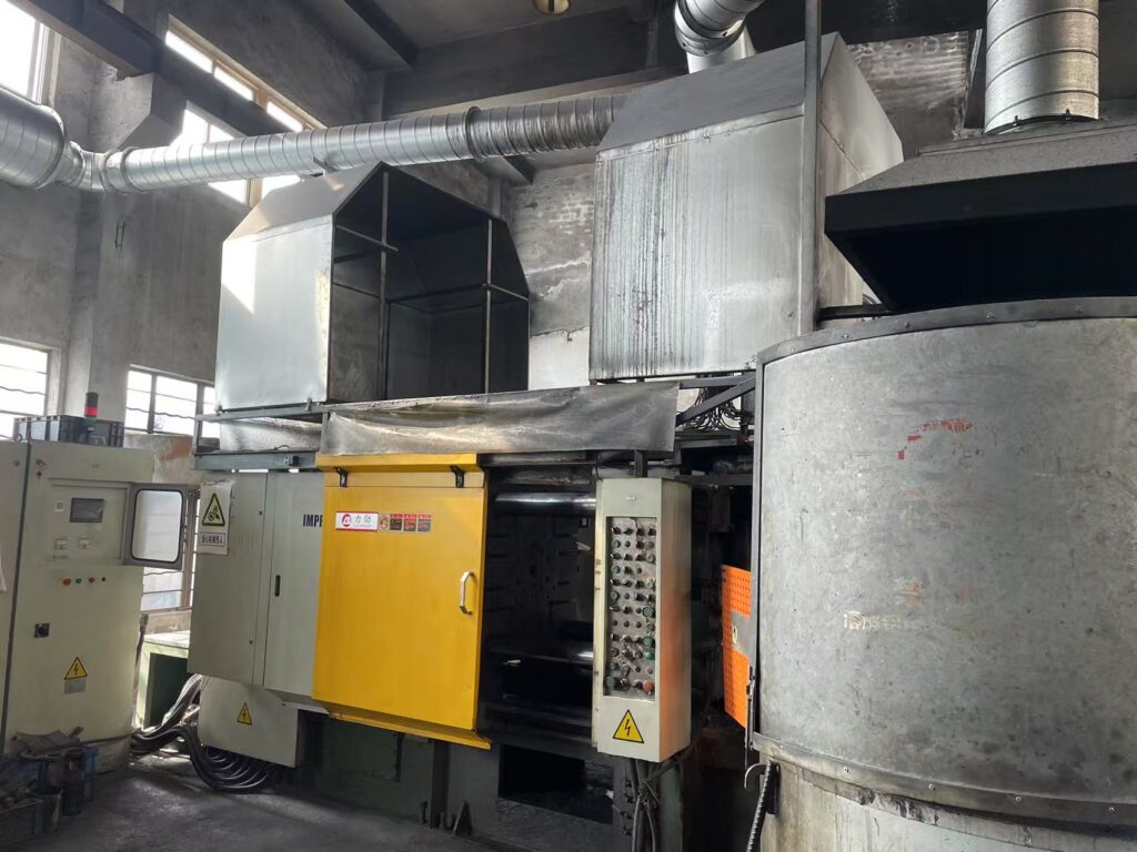 Heavy-duty cold chamber aluminum die casting machine (400T-800T range) in operation at Sureton factory.