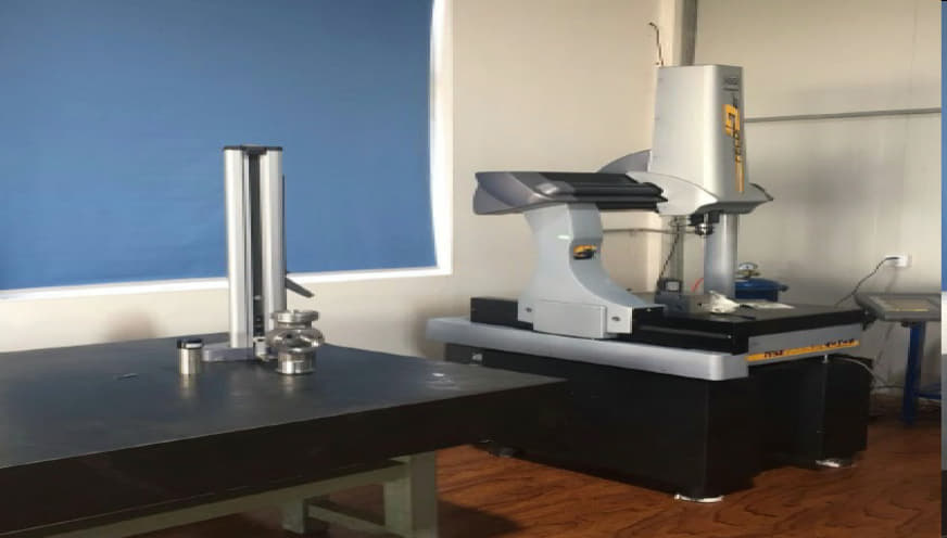 Quality Inspection High-precision Coordinate Measuring Machine (CMM) inspecting CNC machined metal parts at Sureton quality lab.